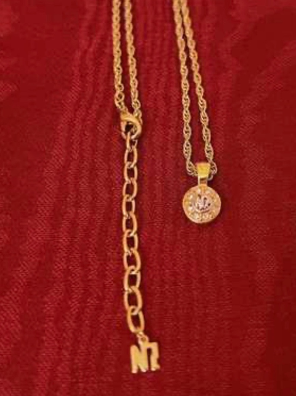 Nina Ricci Gold-Tone Circular Pendant Necklace with Silver 'NR' Accent